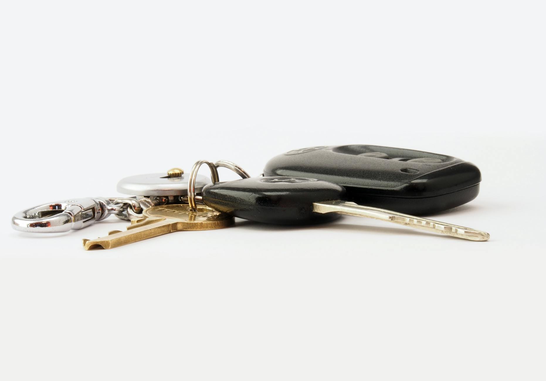 car keys on white surface